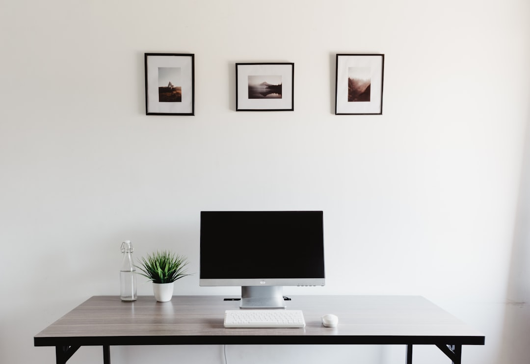 A Professional High Quality Photorealistic Image Featuring A Modern Workspace With A Laptop Displa